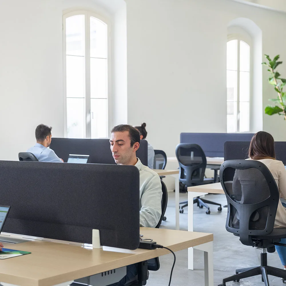 Persone del team Glayx al lavoro, immagine simbolica della cultura aziendale e delle carriere aperte